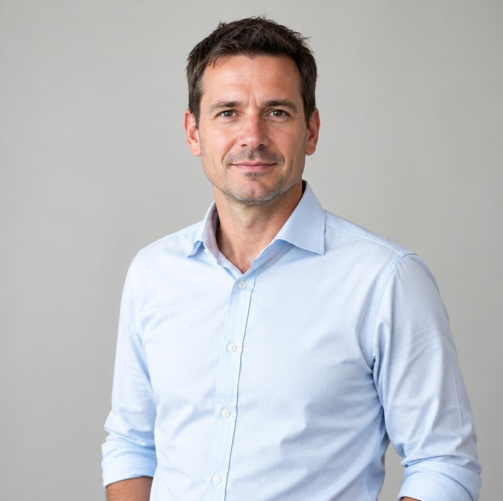Portrait of a smiling man with short dark hair
